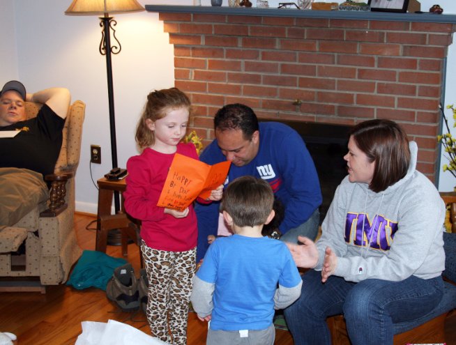 Amber reads her handmade birthday card